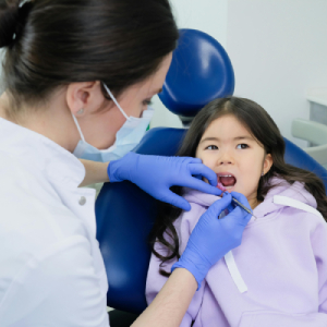 How a Pediatric Dentist in Garden City Prevents Childhood Cavities